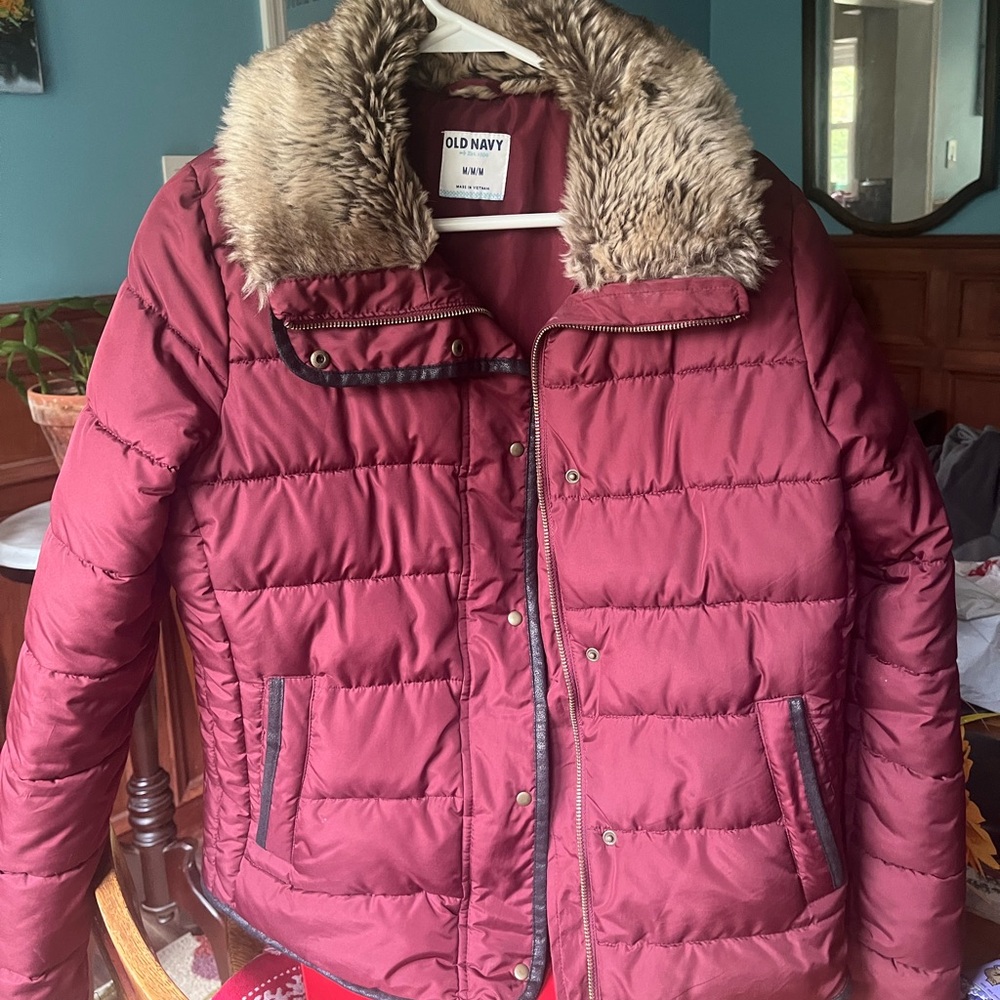 Maroon colored coat. Very comfortable Faux fir on collar.